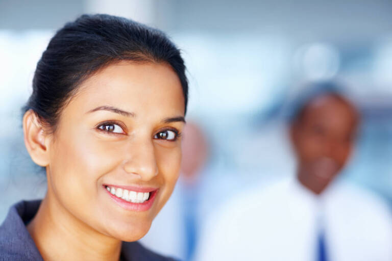 smiling woman in business setting with team 2026 03 25 08 23 45 utc 1 1 768x512